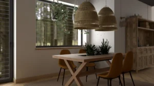 Jadalnia z drewnianym stołem, żółtymi krzesłami i wiklinowymi lampami przy rustyklanej komodzie w realizacji Budy