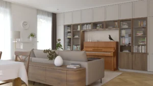 Salon z szarą sofą, drewnianym pianinem, biblioteczką i stolikiem kawowym w realizacji Stocka w Warszawie